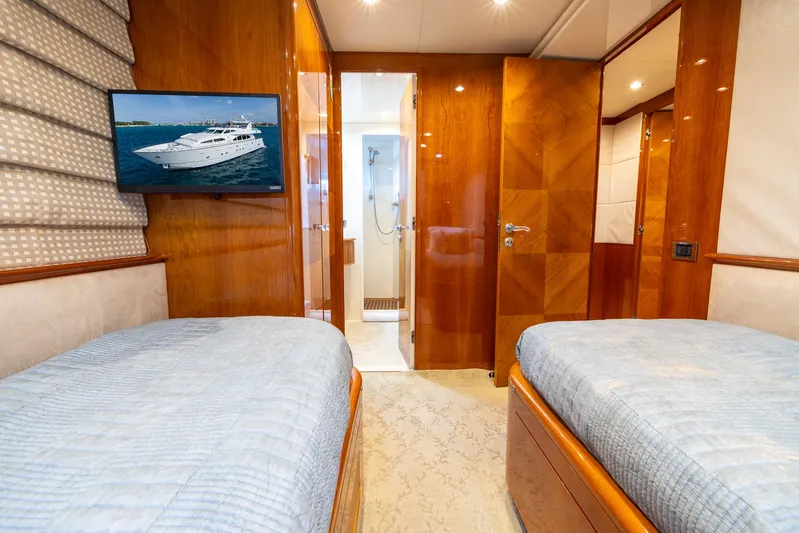  Yacht Photos Pics Twin cabin interior of 1999 Azimut 100 Jumbo yacht with TV and ensuite bathroom.