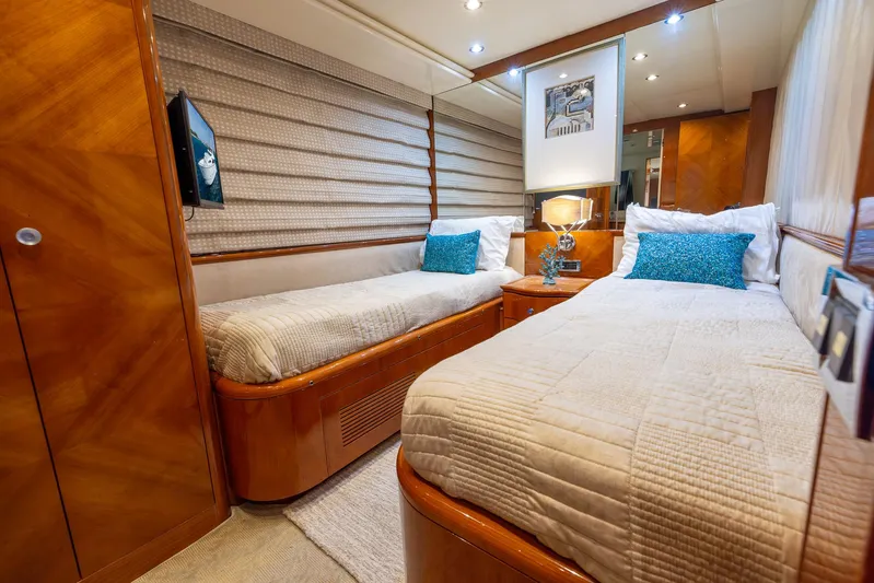  Yacht Photos Pics Luxurious twin bedroom on a 1999 Azimut 100 Jumbo yacht with modern decor.