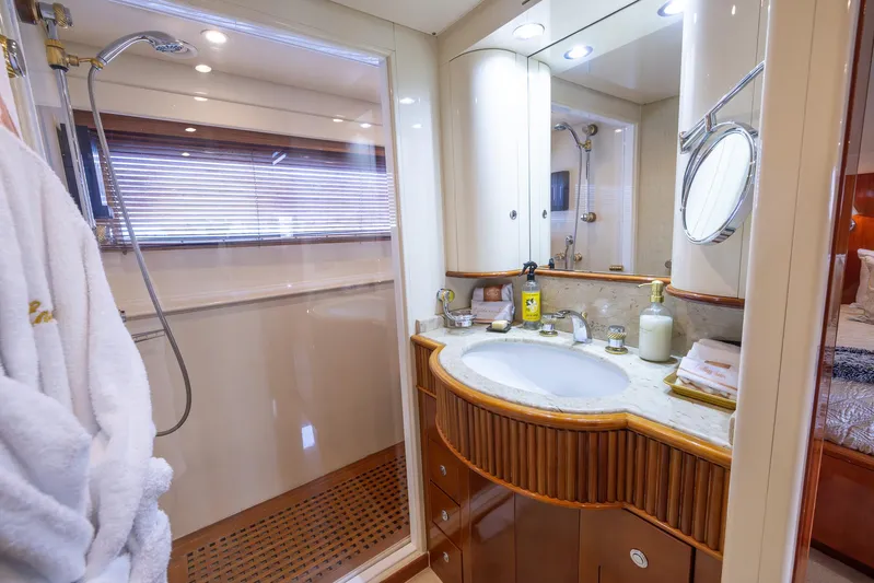  Yacht Photos Pics Luxurious bathroom on a 1999 Azimut 100 Jumbo yacht with shower and vanity.