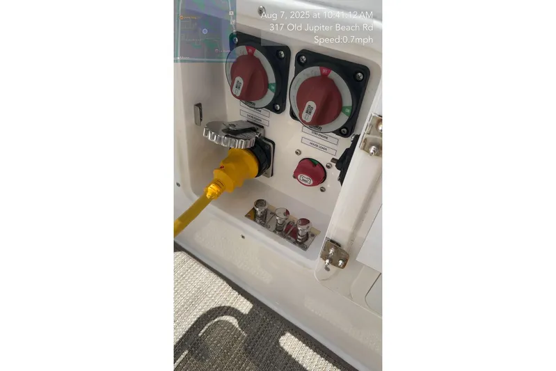  Yacht Photos Pics Power connection panel on 2023 Schaefer 303 Sport boat with yellow cable.