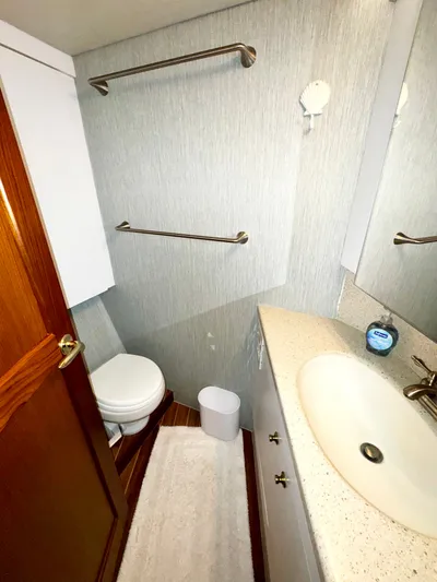 Loon Atik Yacht Photos Pics Bathroom interior of 2005 Ocean Yachts 46 Super Sport, featuring sink and toilet.