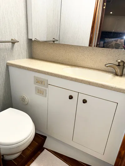 Loon Atik Yacht Photos Pics Bathroom interior of 2005 Ocean Yachts 46 Super Sport, featuring sink and toilet.