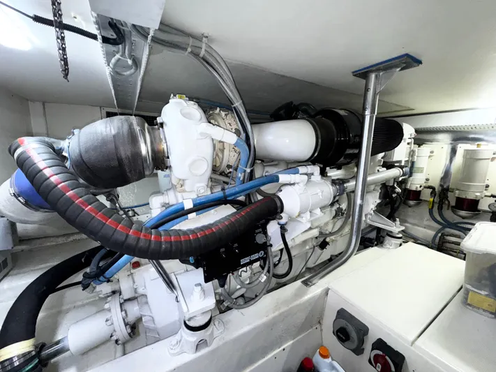 Loon Atik Yacht Photos Pics Engine room of 2005 Ocean Yachts 46 Super Sport, showcasing complex machinery and components.