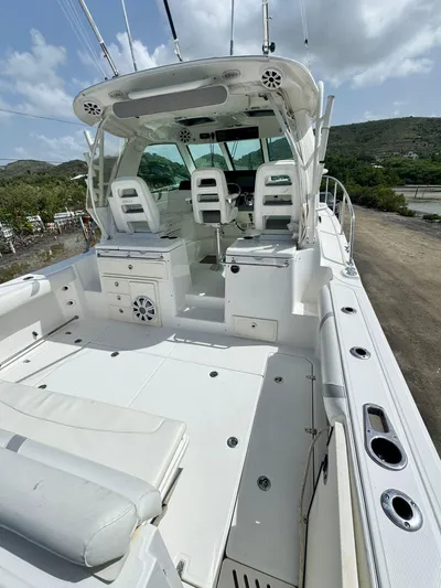  Yacht Photos Pics 2012 Boston Whaler 345 Conquest boat with spacious deck and seating.