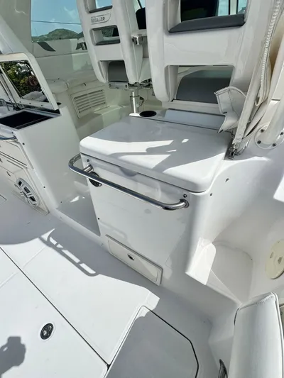  Yacht Photos Pics 2012 Boston Whaler 345 Conquest boat interior with seating and storage.