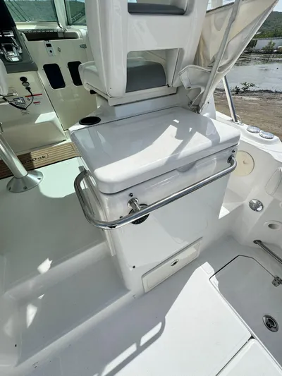  Yacht Photos Pics 2012 Boston Whaler 345 Conquest boat interior with white seating and storage.