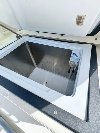  Yacht Photos Pics Open storage compartment on a 2012 Boston Whaler 345 Conquest boat.