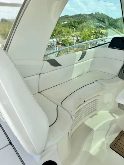  Yacht Photos Pics 2012 Boston Whaler 345 Conquest boat interior with white cushioned seating.