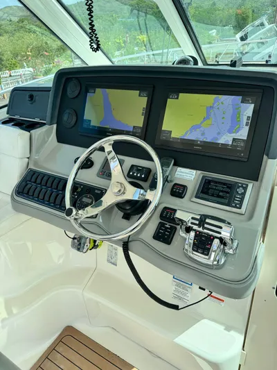  Yacht Photos Pics 2012 Boston Whaler 345 Conquest helm with dual navigation screens and controls.