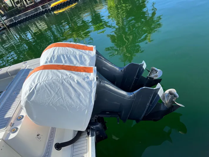 Pura Vida Yacht Photos Pics 2008 Hydra-Sports Vector 3500 VX with twin outboard motors in water.