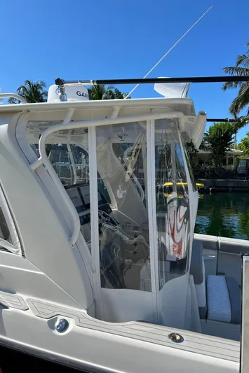 Pura Vida Yacht Photos Pics 2008 Hydra-Sports Vector 3500 VX boat docked near palm trees.