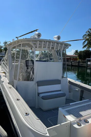 Pura Vida Yacht Photos Pics 2008 Hydra-Sports Vector 3500 VX boat docked, featuring a spacious deck and seating area.