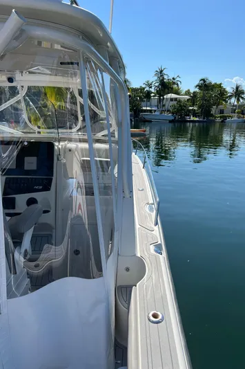 Pura Vida Yacht Photos Pics 2008 Hydra-Sports Vector 3500 VX boat docked by a serene waterfront.