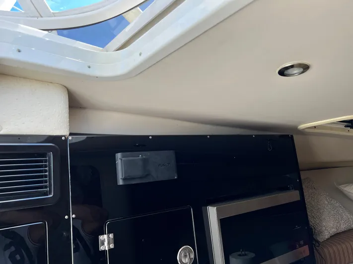 Pura Vida Yacht Photos Pics Interior cabin of 2008 Hydra-Sports Vector 3500 VX with skylight and modern amenities.