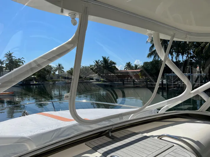 Pura Vida Yacht Photos Pics View from 2008 Hydra-Sports Vector 3500 VX boat, overlooking a serene waterfront.