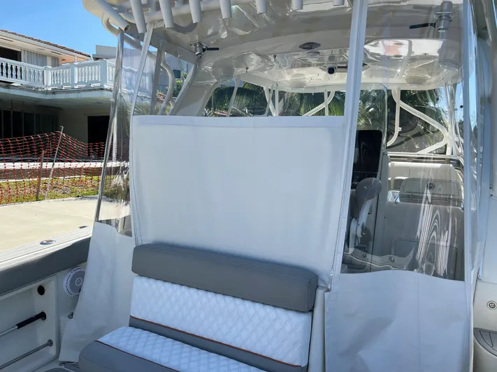 Pura Vida Yacht Photos Pics 2008 Hydra-Sports Vector 3500 VX boat interior with seating and clear enclosure.