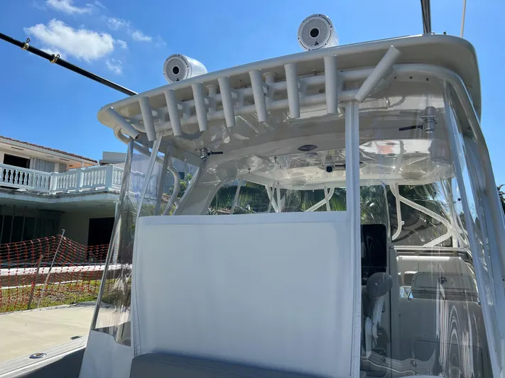 Pura Vida Yacht Photos Pics 2008 Hydra-Sports Vector 3500 VX boat with clear canopy and rod holders.