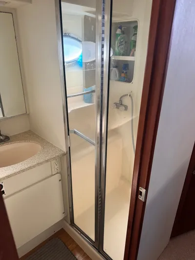 Why Wait Yacht Photos Pics Silverton 392 Motor Yacht 2000 bathroom with shower and sink.