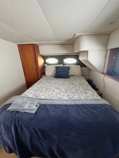 Why Wait Yacht Photos Pics Interior cabin of 2000 Silverton 392 Motor Yacht with bed.