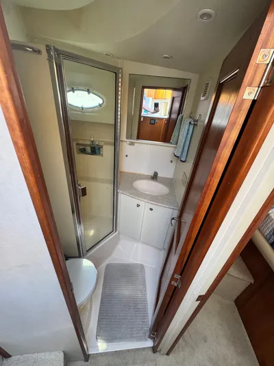 Why Wait Yacht Photos Pics 2000 Silverton 392 Motor Yacht bathroom with shower and sink.