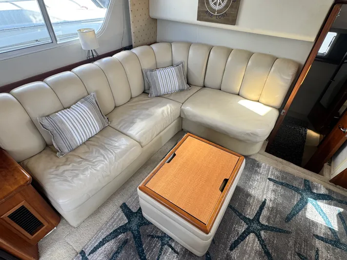 Why Wait Yacht Photos Pics Interior of 2000 Silverton 392 Motor Yacht with leather sofa and cushions.