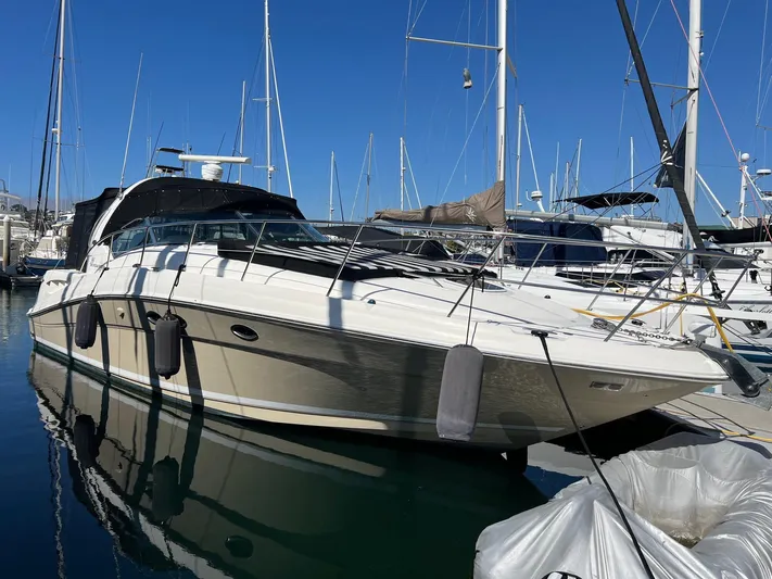  Yacht Photos Pics 2005 Sea Ray 390 Sundancer yacht docked in marina, clear blue sky background.