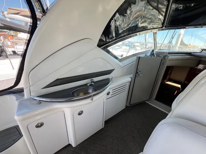  Yacht Photos Pics 2005 Sea Ray 390 Sundancer interior with sink and storage cabinets.