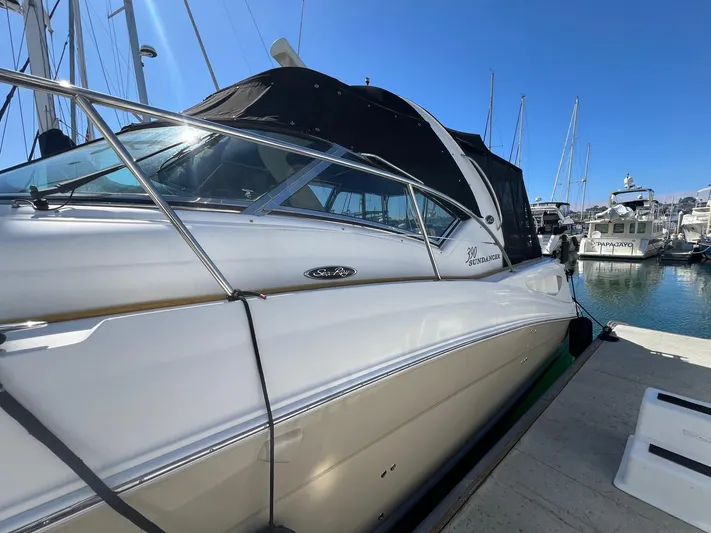  Yacht Photos Pics 2005 Sea Ray 390 Sundancer yacht docked at marina under clear blue sky.