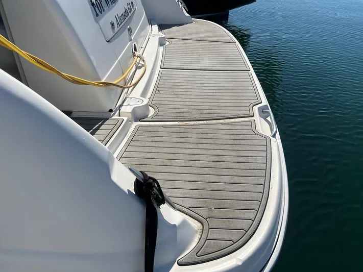  Yacht Photos Pics 2005 Sea Ray 390 Sundancer swim platform with teak decking on calm water.