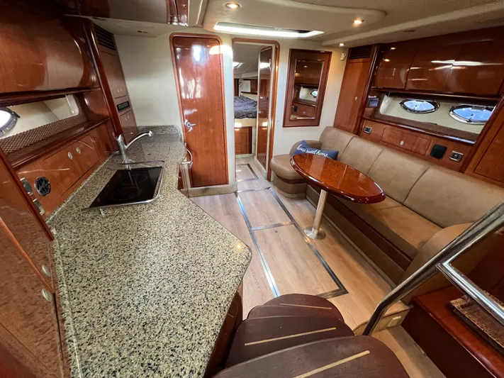  Yacht Photos Pics Luxurious 2005 Sea Ray 390 Sundancer interior with kitchen, seating, and elegant wood finishes.