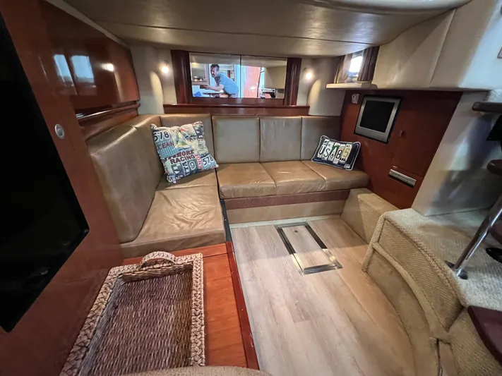  Yacht Photos Pics Luxurious interior of 2005 Sea Ray 390 Sundancer yacht with cozy seating and modern amenities.