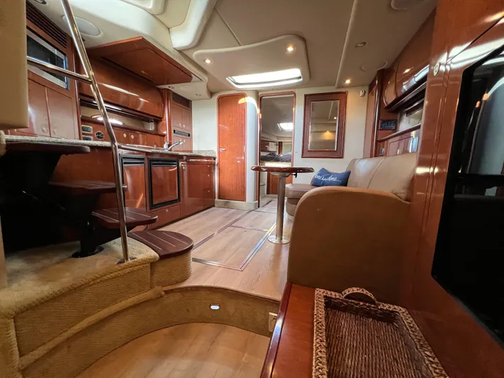  Yacht Photos Pics Luxurious interior of 2005 Sea Ray 390 Sundancer yacht with elegant wood finishes.