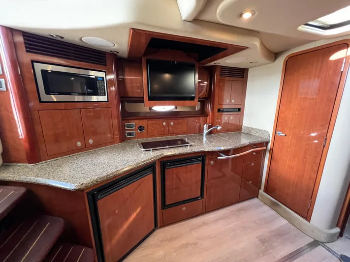  Yacht Photos Pics Luxurious interior of 2005 Sea Ray 390 Sundancer yacht with modern kitchen amenities.