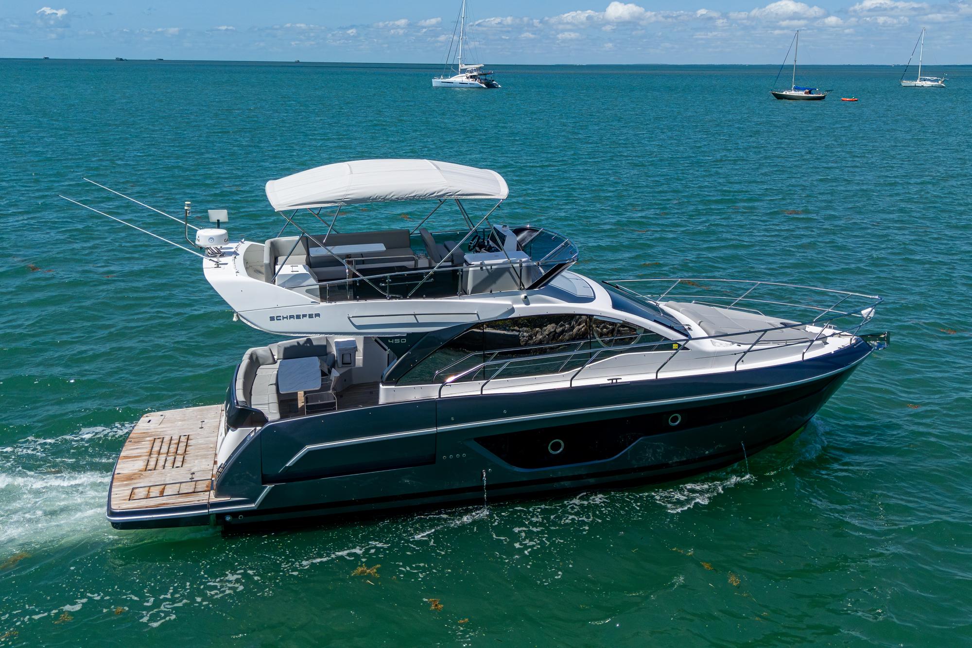 2023 Schaefer 450 yacht cruising on clear blue waters.