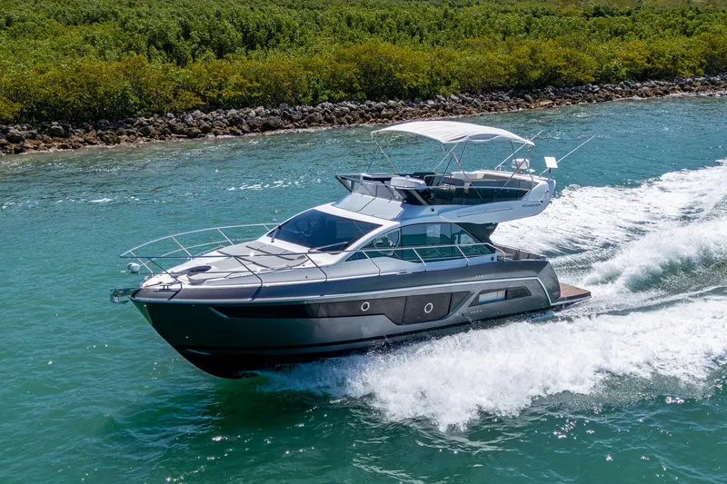 Suntastic Yacht Photos Pics 2023 Schaefer 450 yacht cruising on clear blue water.