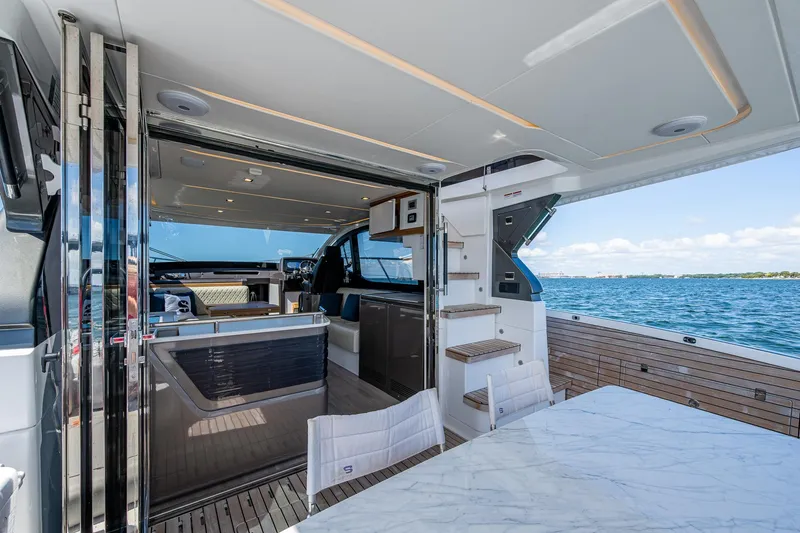 Suntastic Yacht Photos Pics Luxurious 2023 Schaefer 450 yacht interior with ocean view and modern amenities.
