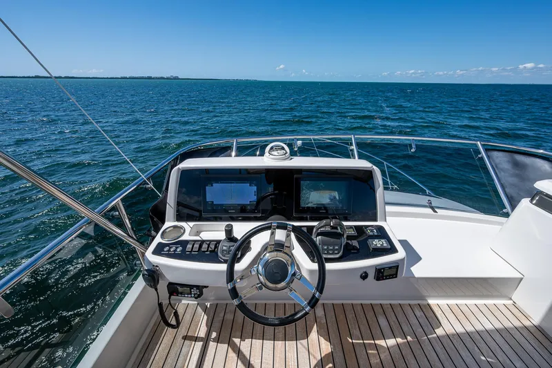 Suntastic Yacht Photos Pics Helm of 2023 Schaefer 450 yacht with ocean view and modern controls.