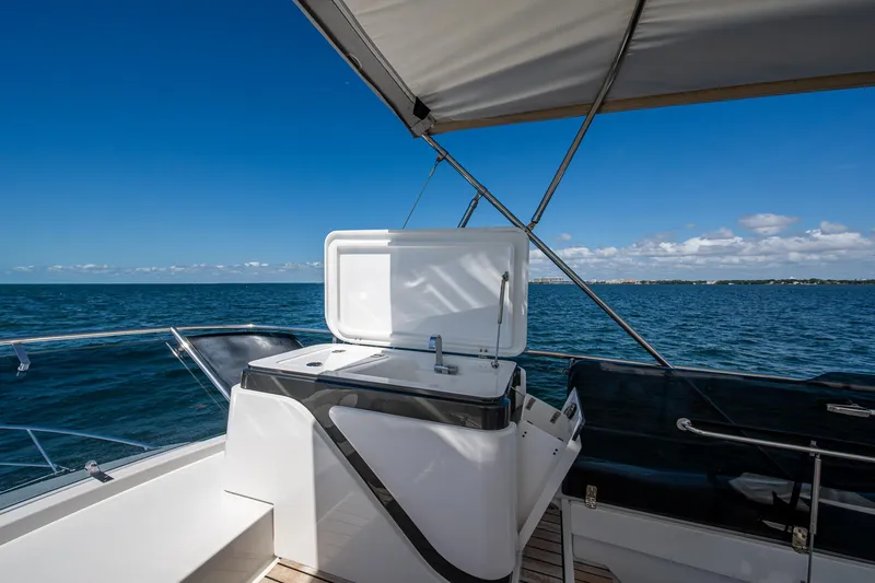 Suntastic Yacht Photos Pics Schaefer 450 yacht deck with open storage, ocean view, and clear blue sky, 2023 model.