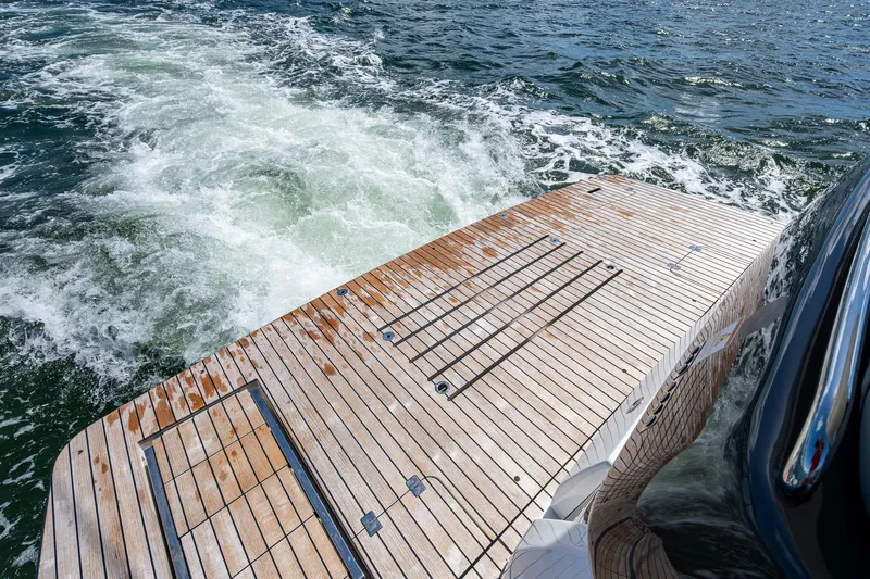 Suntastic Yacht Photos Pics Schaefer 450 yacht's teak deck with ocean waves, 2023 model.