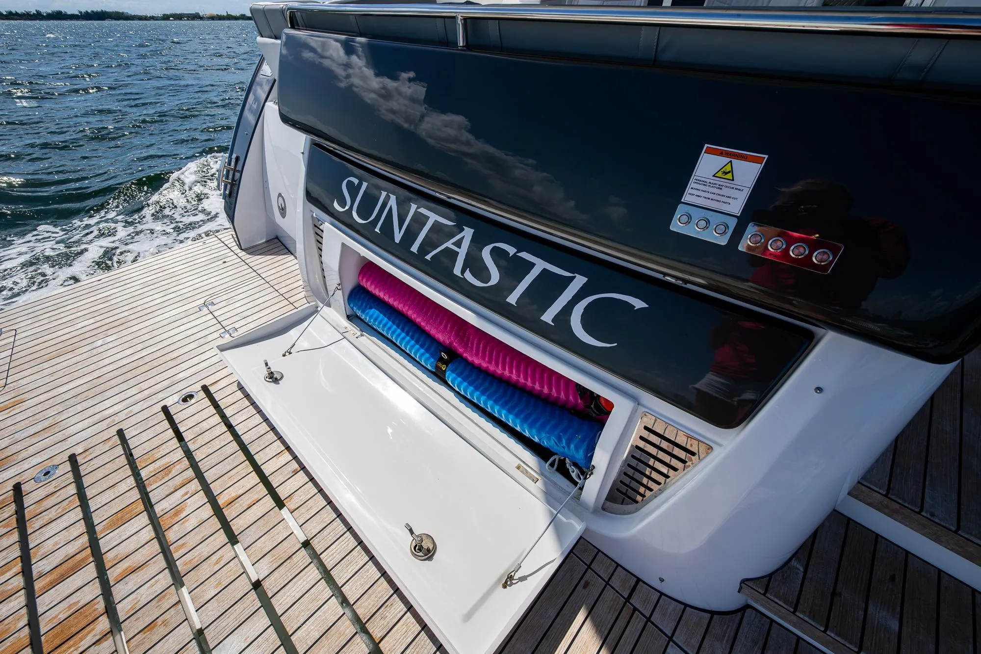 Schaefer 450 yacht deck with storage compartment, 2023 model, on open water.