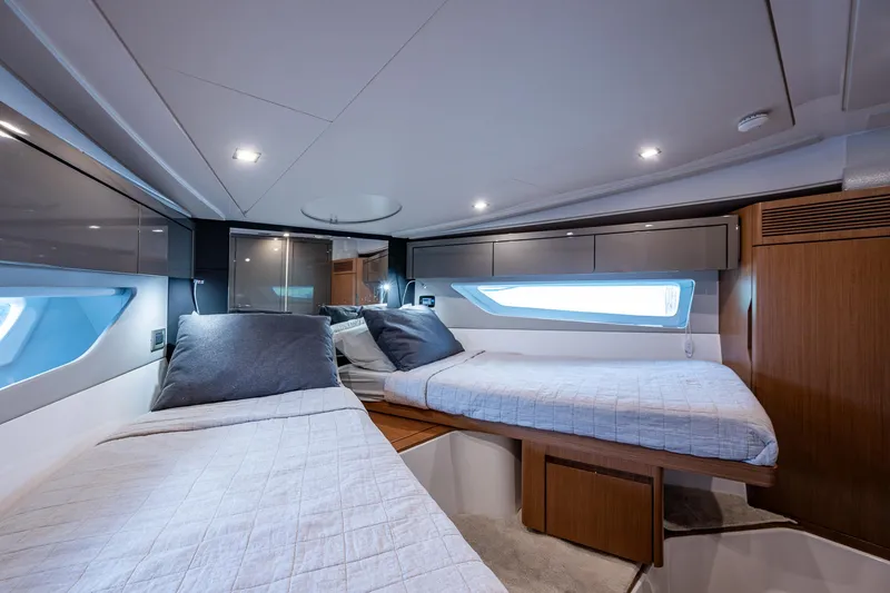 Suntastic Yacht Photos Pics Luxurious cabin interior of 2023 Schaefer 450 yacht with twin beds and modern design.