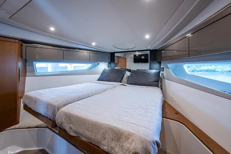 Suntastic Yacht Photos Pics Luxurious cabin interior of 2023 Schaefer 450 yacht with modern bedding and sleek design.