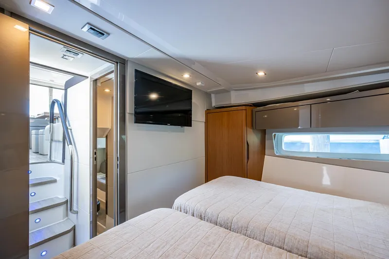Suntastic Yacht Photos Pics Luxurious cabin interior of 2023 Schaefer 450 yacht with twin beds and modern amenities.