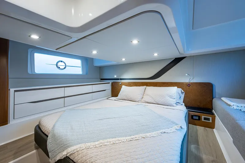 Suntastic Yacht Photos Pics Luxurious cabin interior of 2023 Schaefer 450 yacht with modern design and cozy bedding.