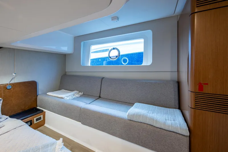 Suntastic Yacht Photos Pics Interior of 2023 Schaefer 450 yacht with modern gray seating and window view.