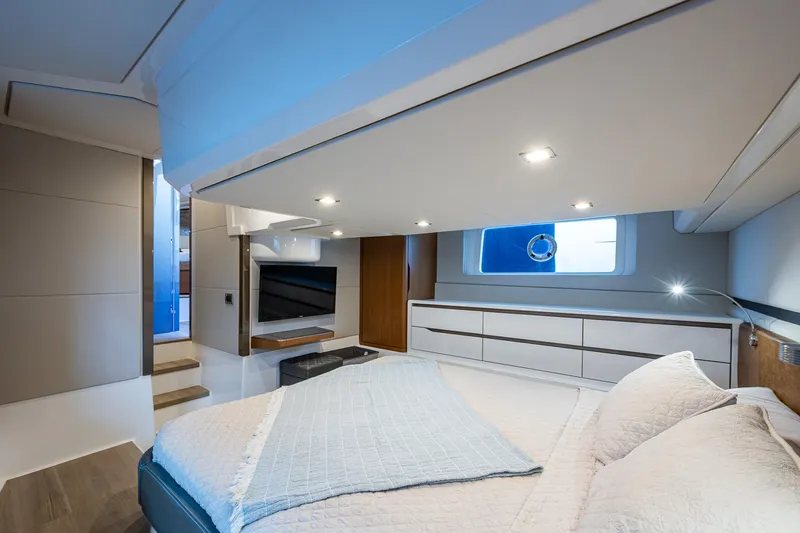 Suntastic Yacht Photos Pics Luxurious cabin interior of 2023 Schaefer 450 yacht with modern design and cozy bedding.
