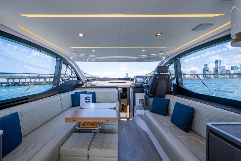 Suntastic Yacht Photos Pics Luxurious interior of 2023 Schaefer 450 yacht with panoramic windows and elegant seating.