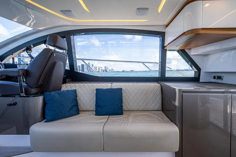 Suntastic Yacht Photos Pics Luxurious interior of 2023 Schaefer 450 yacht with modern seating and ocean view.