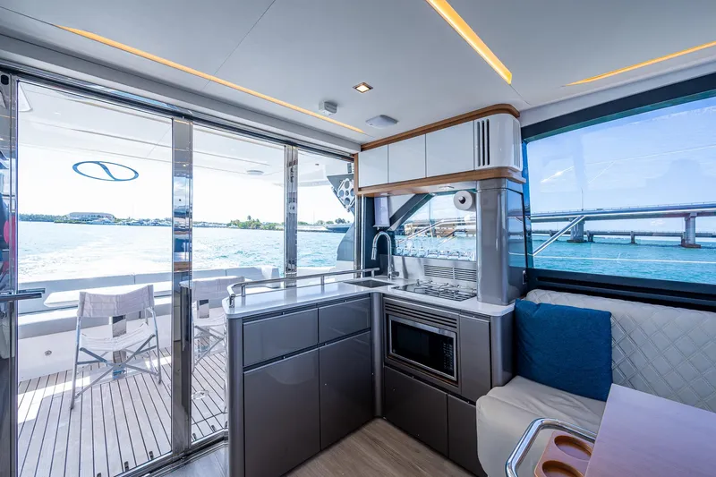 Suntastic Yacht Photos Pics Modern kitchen interior on 2023 Schaefer 450 yacht with ocean view.