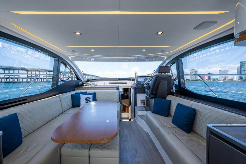 Suntastic Yacht Photos Pics Luxurious interior of 2023 Schaefer 450 yacht with elegant seating and scenic ocean view.